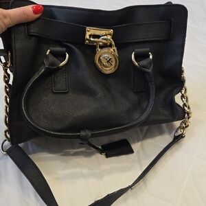 Michael Kors Leather Handbag with Gold Accents.